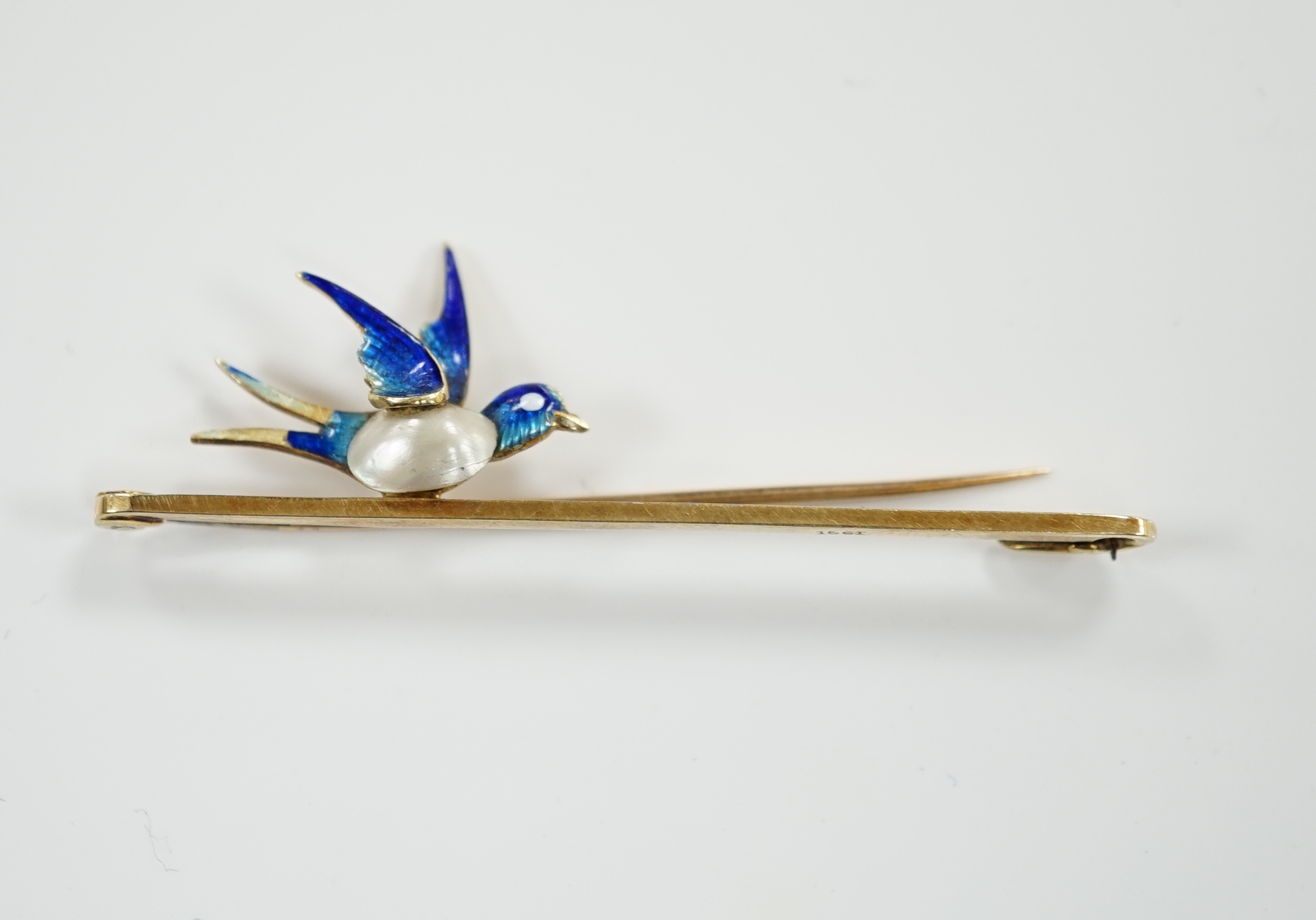 A yellow metal, baroque pearl and enamel bluebird bar brooch, 48mm, gross weight 3.1 grams.